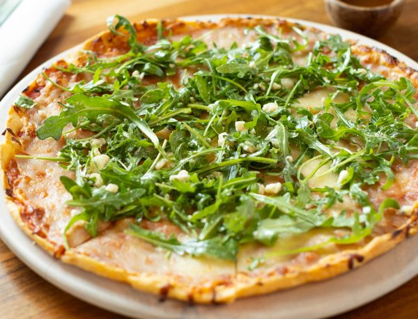 Thin Crust Pizza with Arugula Salad and Little BEEst Sneaker Green Jalapeño Hot Honey Sauce