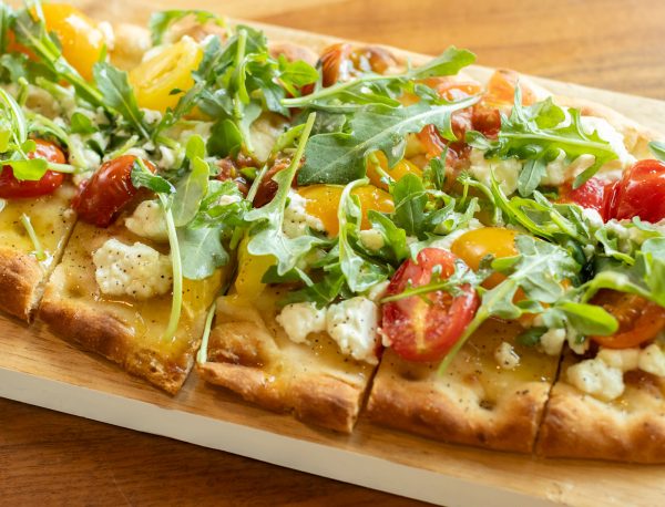 Flatbread hors d'oeuvre with Little BEEst Hot Honey Sauce